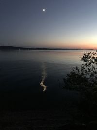 Scenic view of sea against sky at night