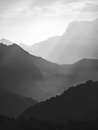 Sun rays land on the french alps in black and white