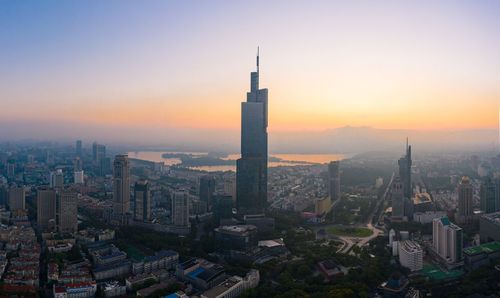 High angle view of city buildings during sunset