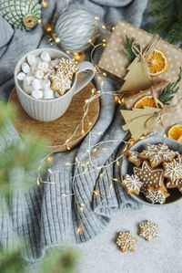 Hot chocolate with marshmallows, warm cozy christmas drink, gingerbread cookies and decorations