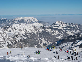 High angle view of people on mountain during winter