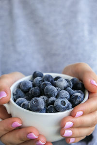 Close-up of hand holding fruits