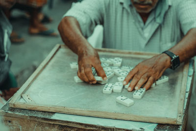 Midsection of man working at table