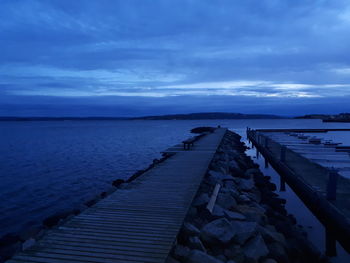 Pier over sea against sky