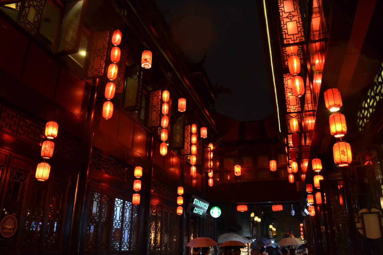 LOW ANGLE VIEW OF ILLUMINATED LIGHTS IN BUILDING