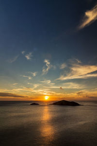 Scenic view of sea against sky during sunset