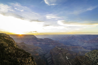 High angle view of dramatic landscape against sky during sunset