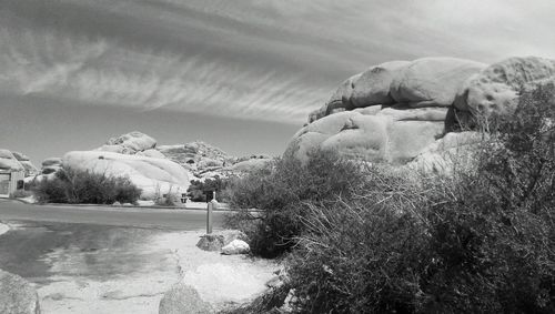 Scenic view of mountains against cloudy sky