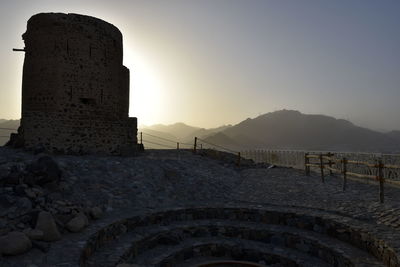 Historic building against sky during sunset