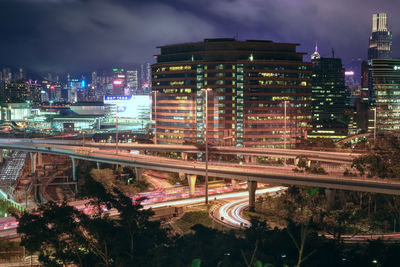 High angle view of illuminated buildings against sky at night