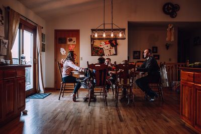 People sitting on chair at home