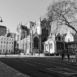 Buildings in city against clear sky