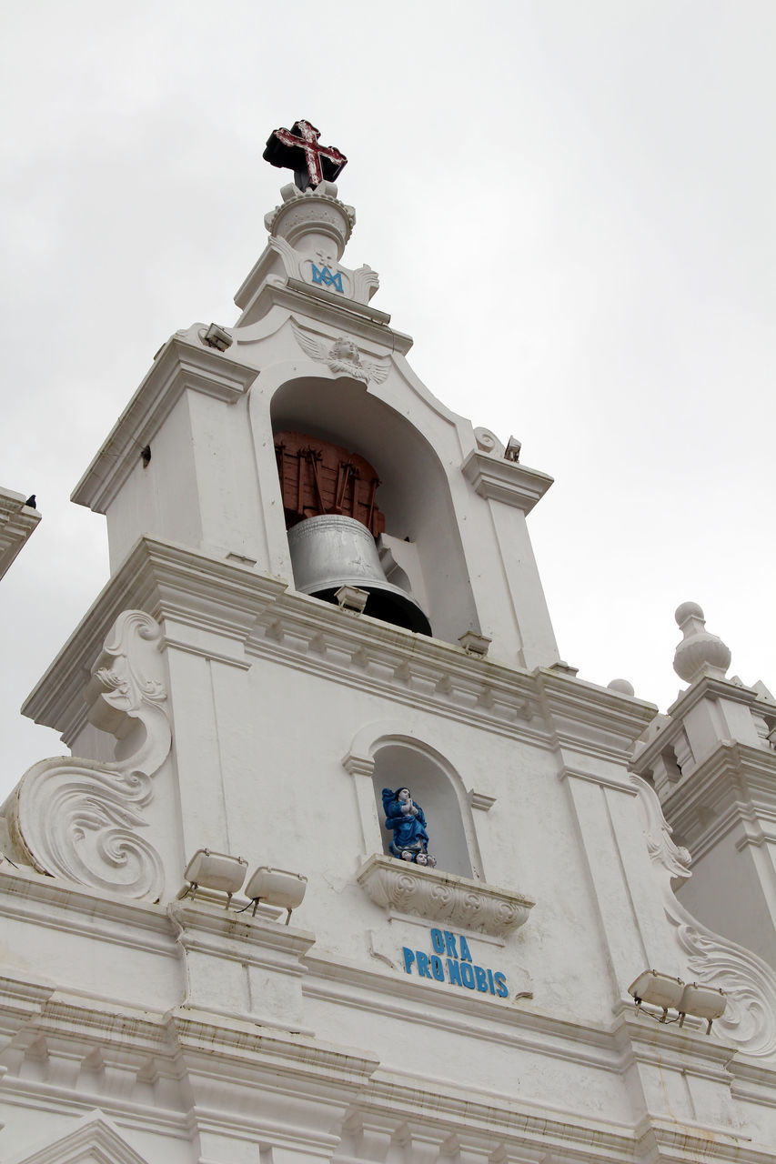 LOW ANGLE VIEW OF BELL TOWER AGAINST BUILDING