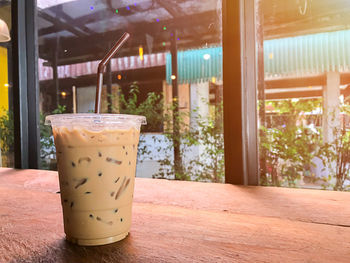 Glass of drink on table