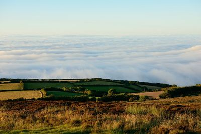 High angle view of fields against clouds