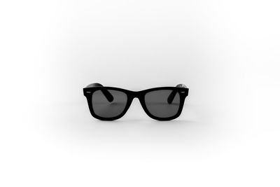 Close-up of sunglasses against white background