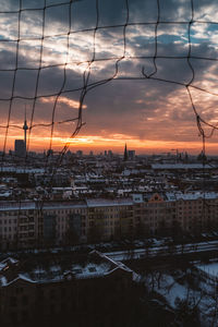 Cityscape against sky during sunset