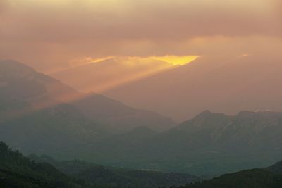 Scenic view of mountains against sky during sunset