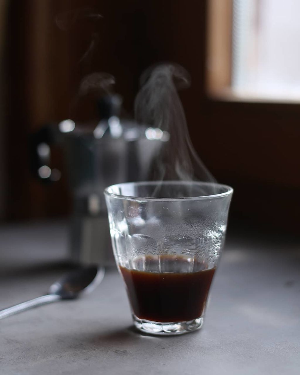 CLOSE-UP OF GLASS OF JUICE ON TABLE