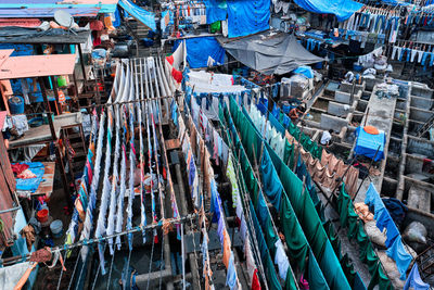 Dhobi ghat is an open air laundromat lavoir in mumbai, india with laundry drying on ropes