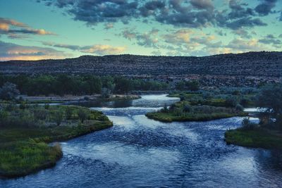 Scenic view of river against sky