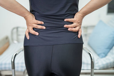 Midsection of woman standing in gym