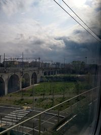 View of arch bridge against sky