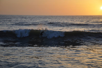 Scenic view of sea against sky during sunset