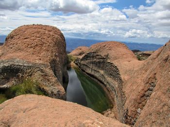 Panoramic view of rock formations against sky