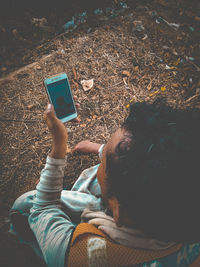 High angle view of man using mobile phone