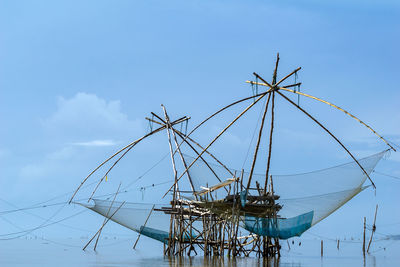 Low angle view of sailboat against blue sky