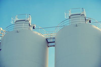 Low angle view of factory against sky