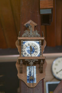 Close-up of clock against wall