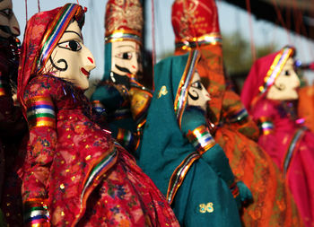 Close-up of traditional dolls for sale