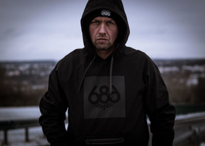 Portrait of young man standing outdoors