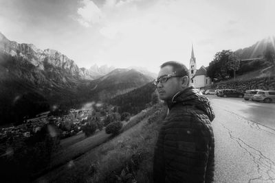 Side view portrait of young man standing on mountain