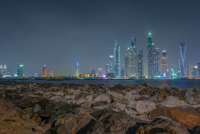 Illuminated cityscape at night