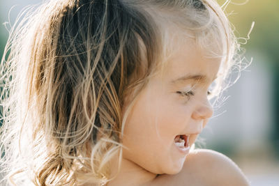 Close-up of cute girl outdoors