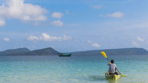 Kayak in paradise on koh rong, cambodia