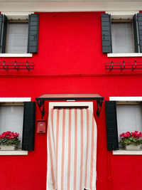 Low angle view of coloured red building in venice italy