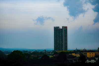 Modern buildings in city against sky