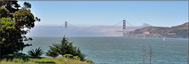 View of suspension bridge over sea