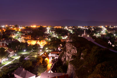 High angle view of illuminated buildings in city at night