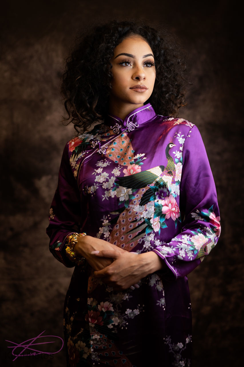 one person, standing, young adult, clothing, three quarter length, women, indoors, traditional clothing, adult, young women, front view, real people, looking at camera, lifestyles, hairstyle, beautiful woman, pattern, beauty, portrait, floral pattern