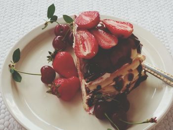 High angle view of strawberries in plate on table