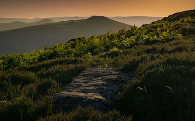 Scenic view of mountains against sky during sunset