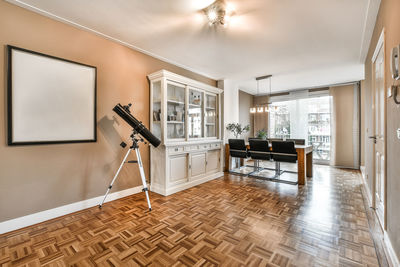 Empty chairs and tables against wall at home