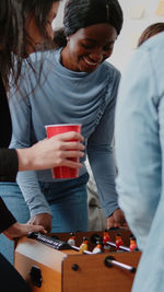 Rear view of woman using mobile phone