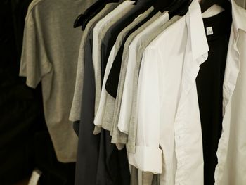 Clothes hanging on rack in store