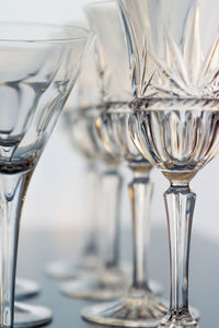 Close-up of wine glasses on table